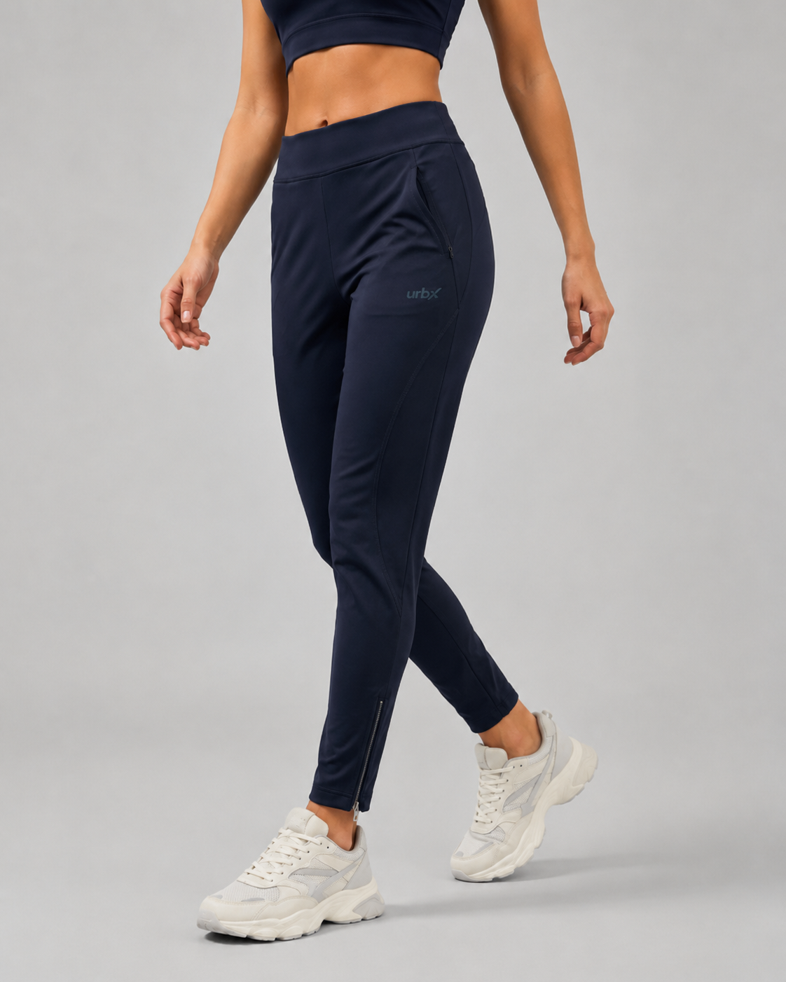 URBX Woven High-Waist Training Pants Navy - Walking side angle lifestyle view