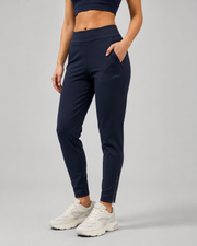 URBX Woven High-Waist Training Pants Navy - Side angle front view with hand in pocket