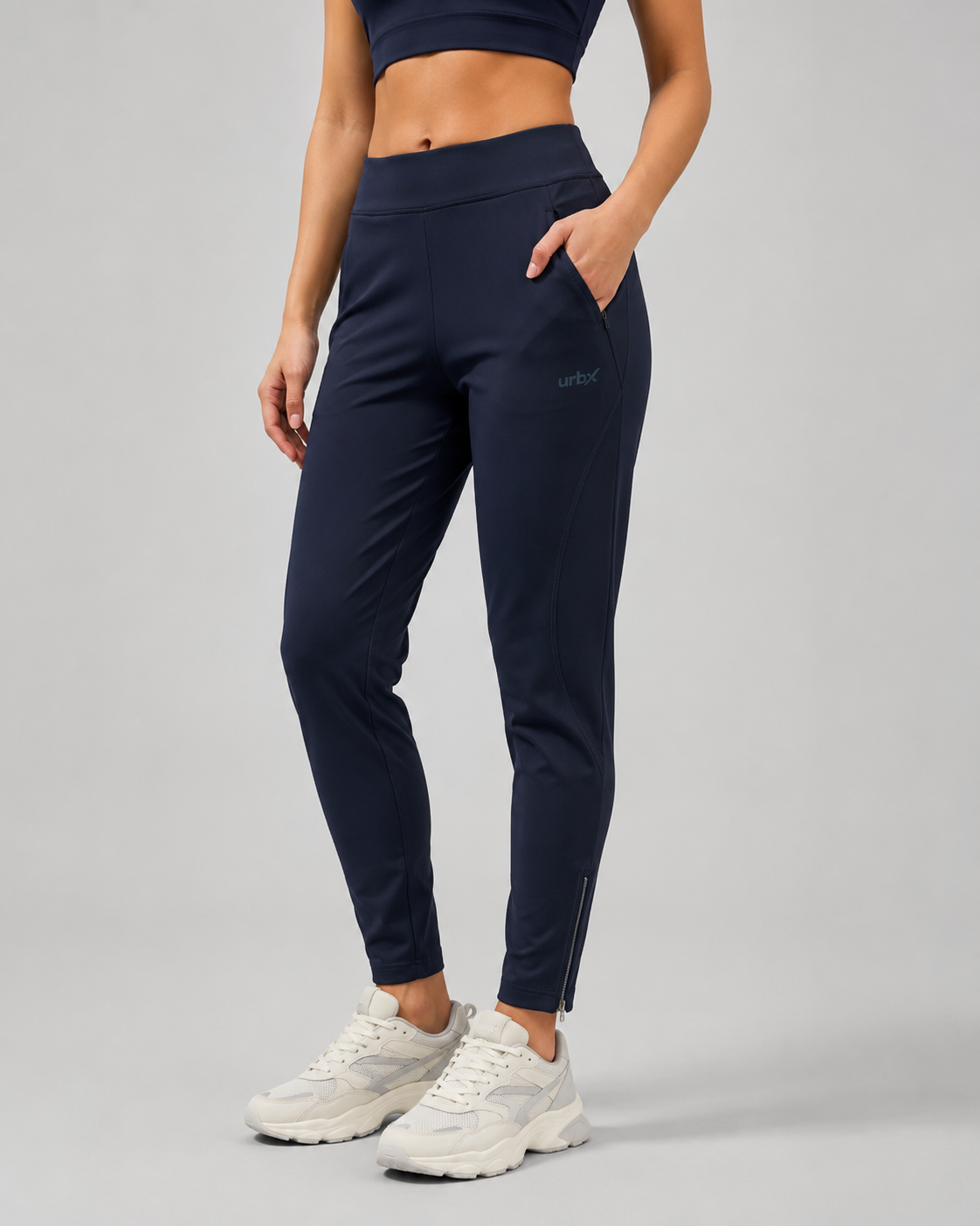 URBX Woven High-Waist Training Pants Navy - Side angle front view with hand in pocket