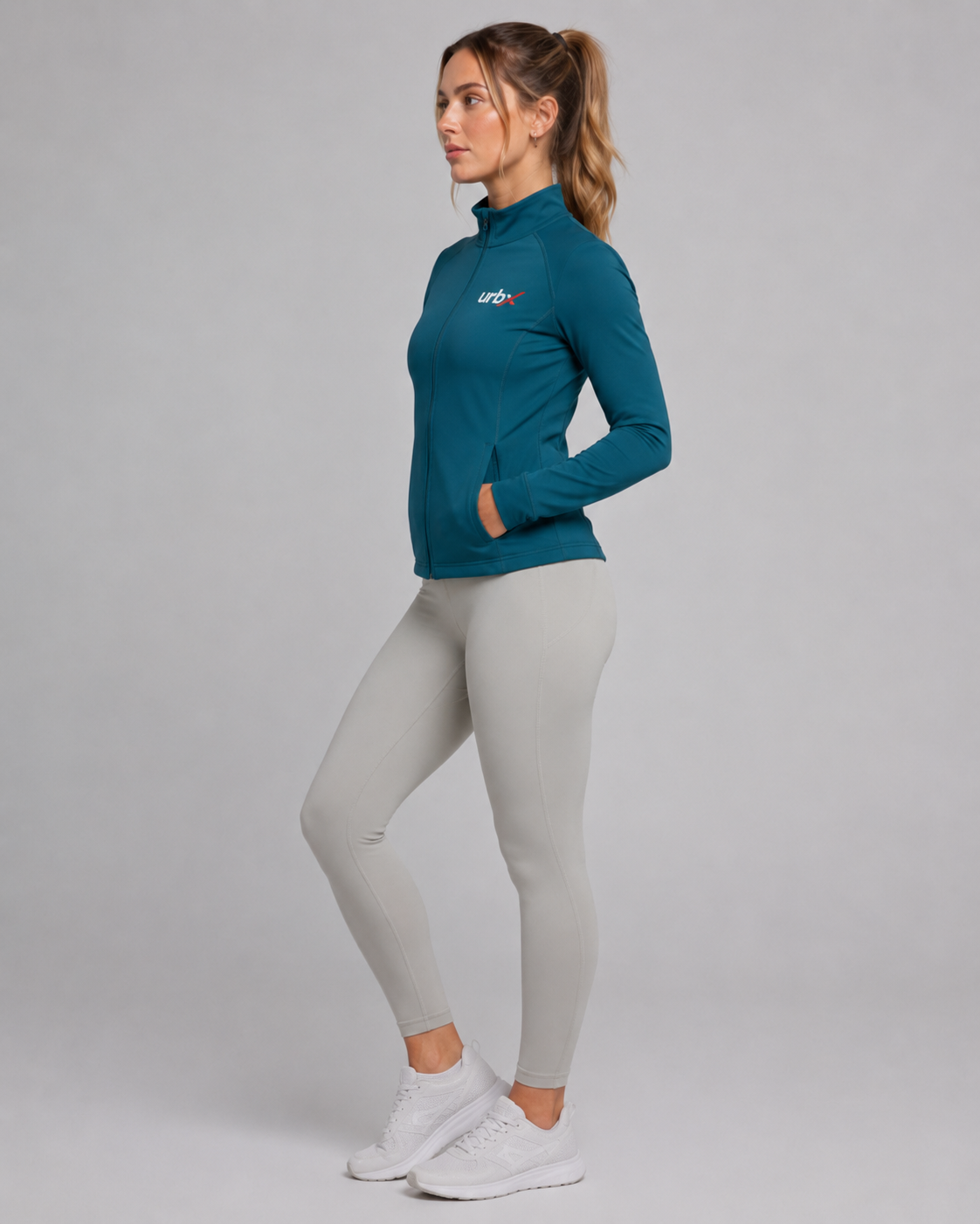URBX Women Pro Full-Zip Jacket Teal - Side Profile Hand in Pocket