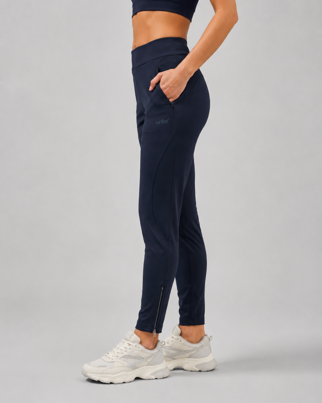 URBX Woven High-Waist Training Pants Navy - Side view showing ankle zip detail