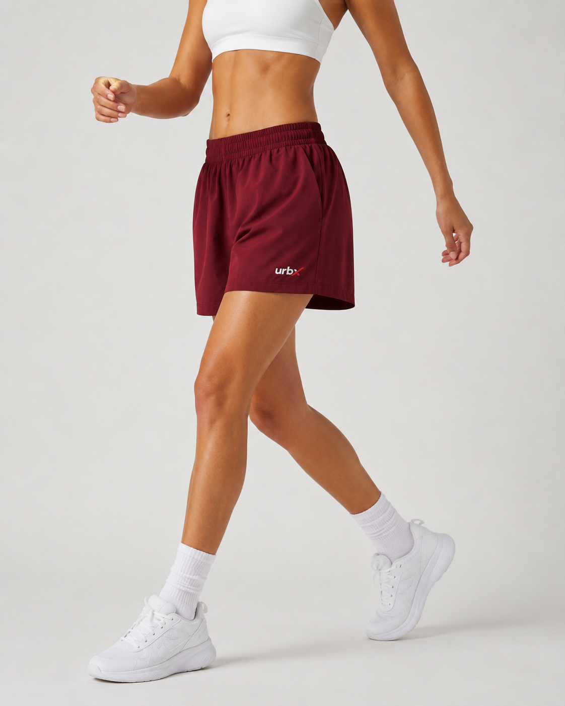 URBX High-Waist Training Shorts Burgundy – Walking side view