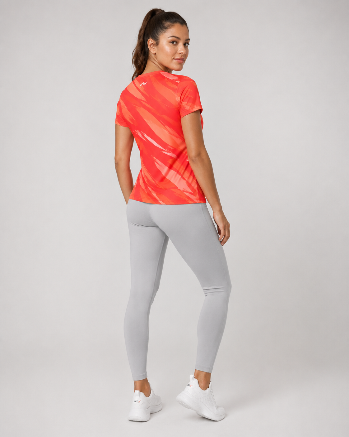 URBX Graphic Performance Tee Coral Red – Back angle view