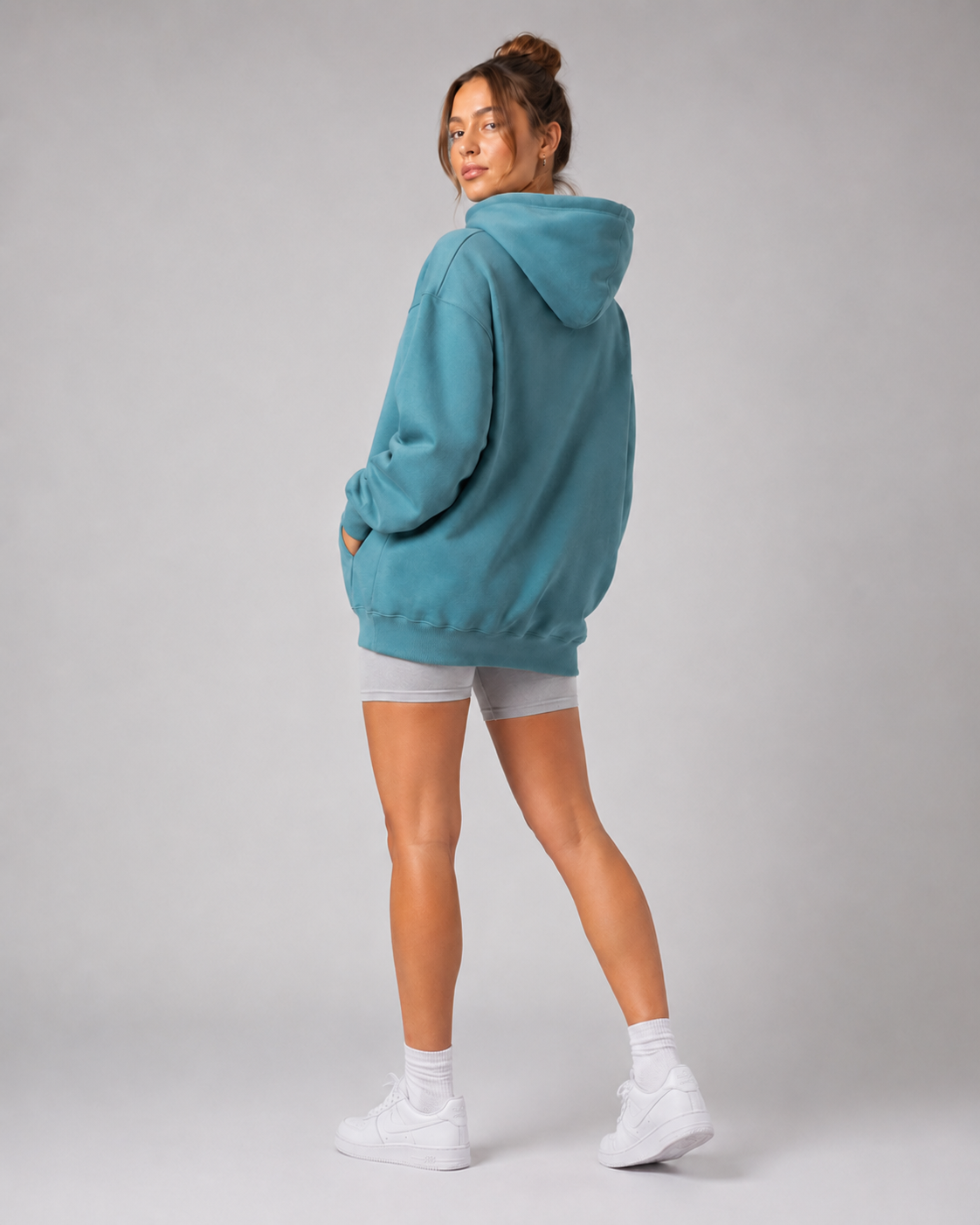 URBX Oversized Hoodie Teal - Back three quarter angle walking