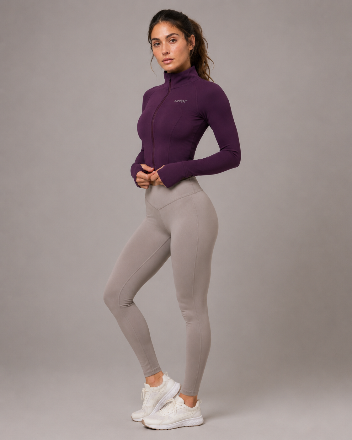 URBX Seamless Cropped Zip-Up Performance Jacket Plum - Side view with thumb holes detail